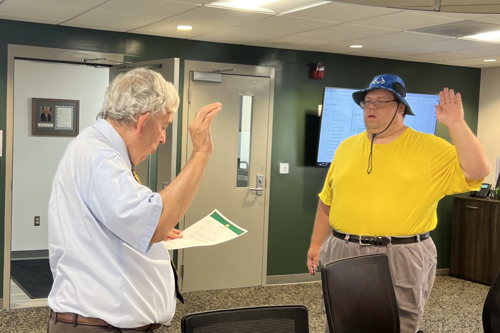 David Akers is sworn in by fellow MCBDD board member, Ted Frericks